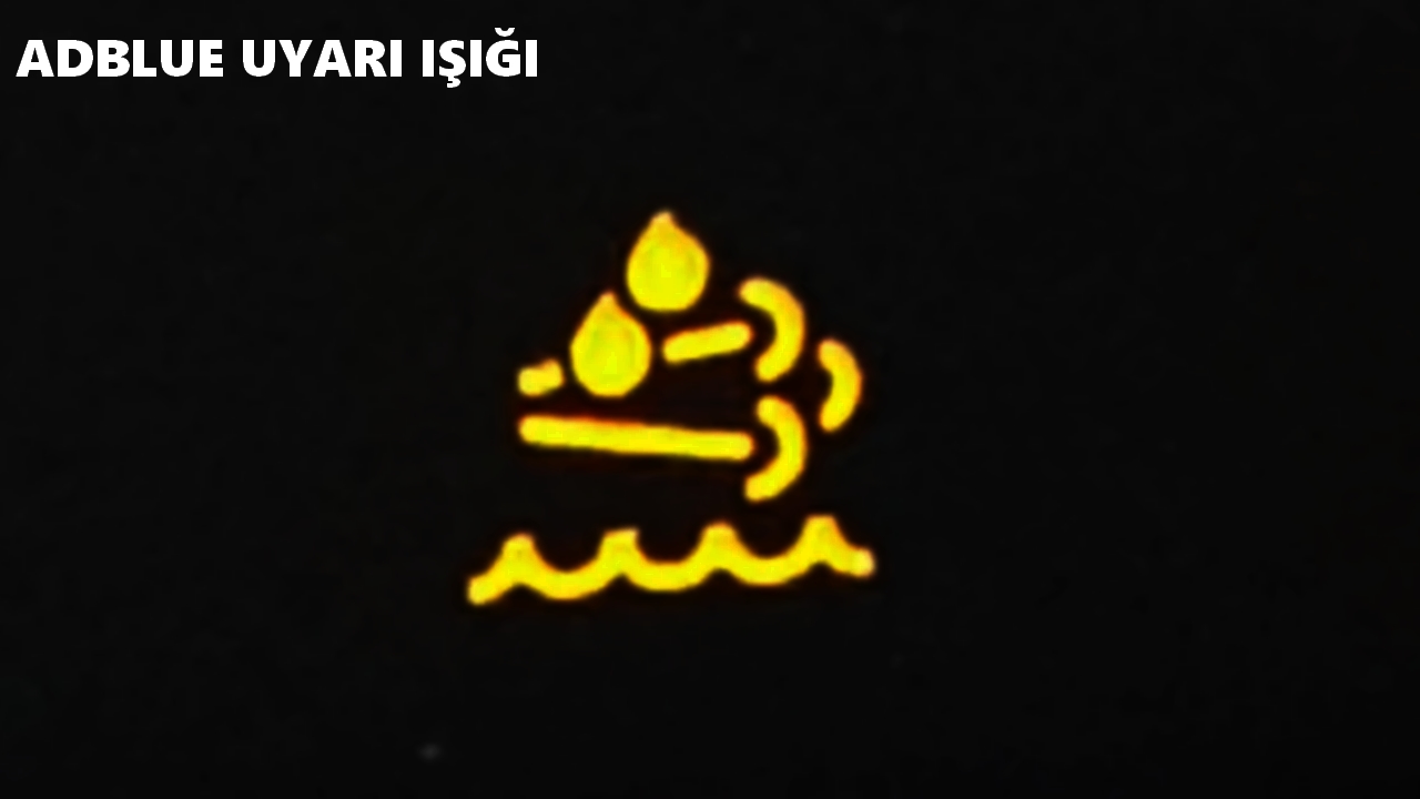 Adblue Uyarı Işığı - Sarı renkli egzoz dumanı üstünde damla şeklinde gösterilir